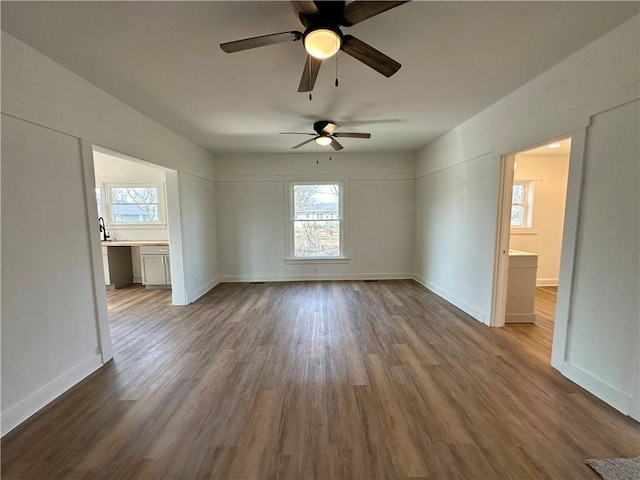 empty room with hardwood / wood-style flooring and built in desk