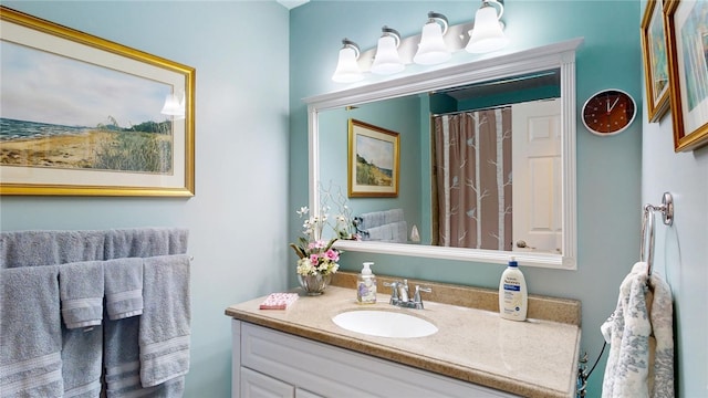 bathroom with a shower with curtain and vanity