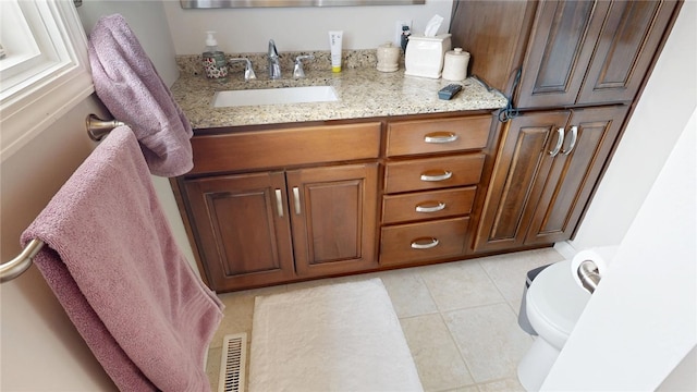 bathroom featuring toilet, tile patterned flooring, visible vents, and vanity