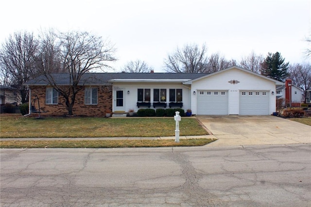 ranch-style house featuring concrete driveway, a front lawn, an attached garage, and brick siding