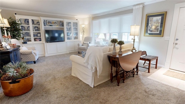 carpeted living room featuring ornamental molding