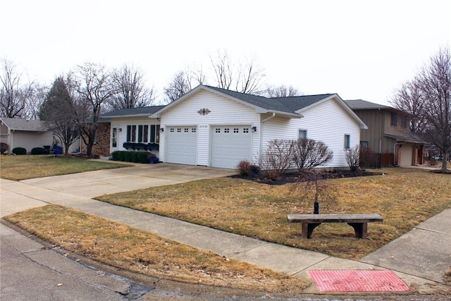 single story home with a front lawn, driveway, and an attached garage