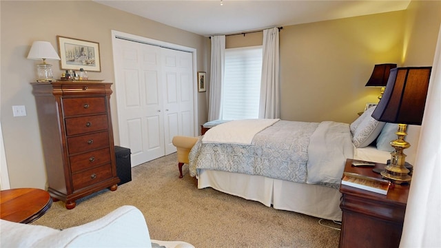 carpeted bedroom featuring a closet