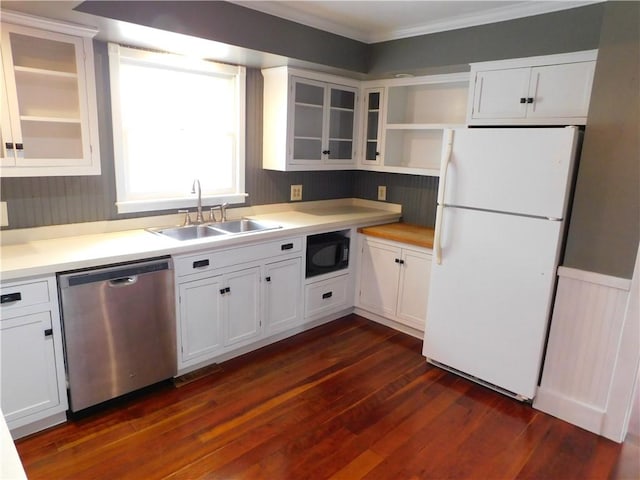 kitchen featuring freestanding refrigerator, stainless steel dishwasher, black microwave, open shelves, and a sink