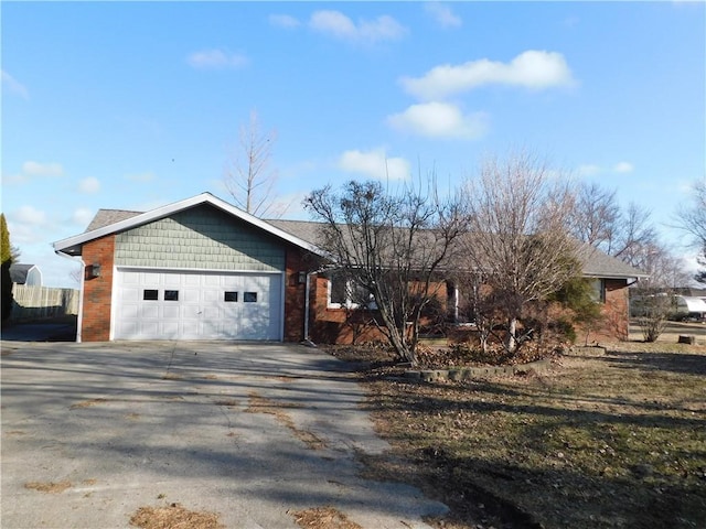 view of front of home with driveway and an attached garage