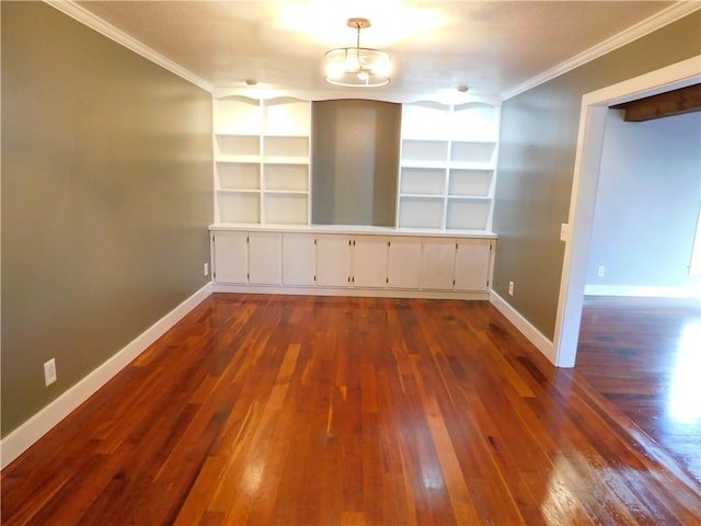 unfurnished room featuring a notable chandelier, baseboards, ornamental molding, and dark wood-style flooring