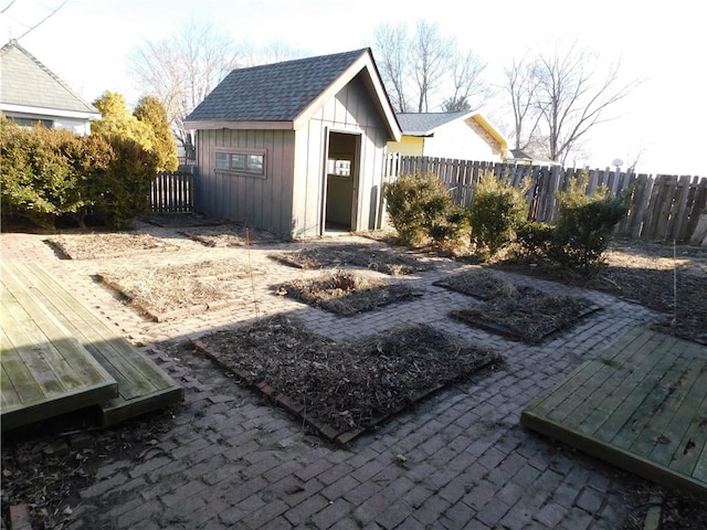 view of outdoor structure with an outdoor structure and a fenced backyard