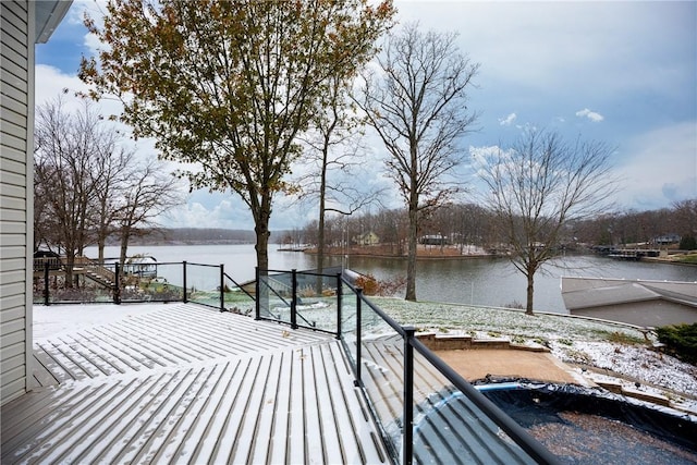 wooden deck featuring a water view