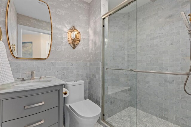 washroom with light wood-type flooring, cabinets, and washer and dryer