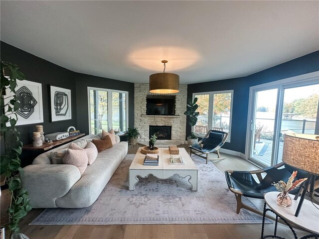 living room featuring light hardwood / wood-style flooring and a fireplace