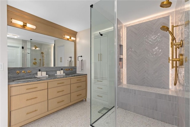 bathroom with vanity and a shower