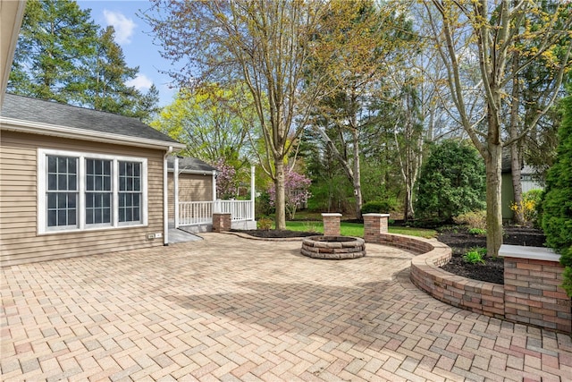 view of patio featuring an outdoor fire pit