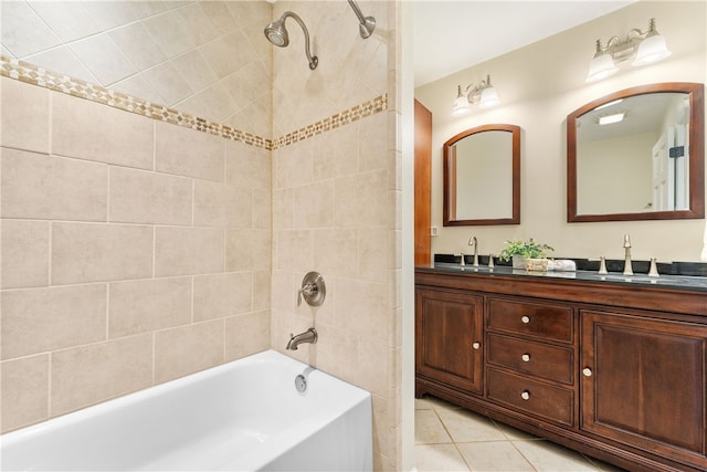 bathroom featuring double vanity, tile patterned floors, shower / washtub combination, and a sink