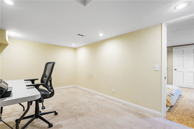 unfurnished office with baseboards, carpet, recessed lighting, and visible vents