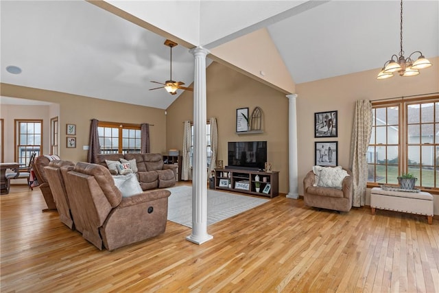 11154 E Ravenwood Ct, Effingham, IL 62401 - living area featuring ornate columns, high vaulted ceiling, hardwood / wood-style flooring, ceiling fan, and a chandelier