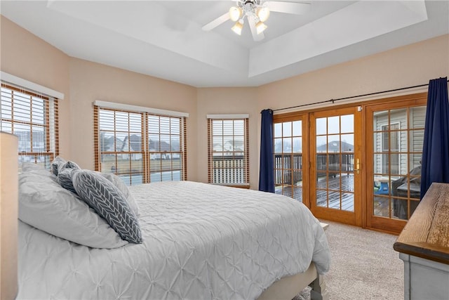 11154 E Ravenwood Ct, Effingham, IL 62401 - bedroom with carpet floors, a ceiling fan, access to exterior, and a tray ceiling