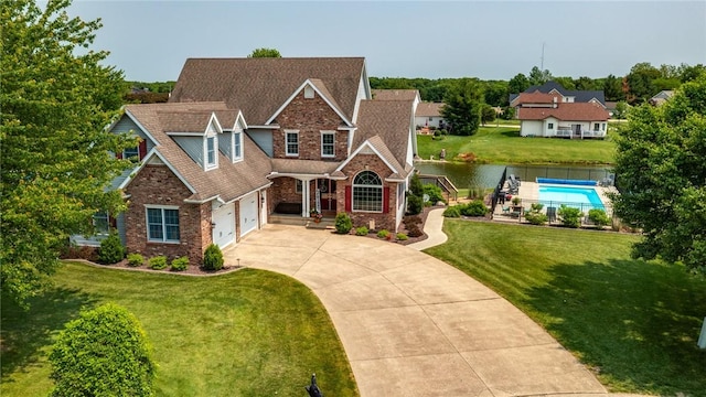 11154 E Ravenwood Ct, Effingham, IL 62401 - view of front of property with concrete driveway, an attached garage, and brick siding