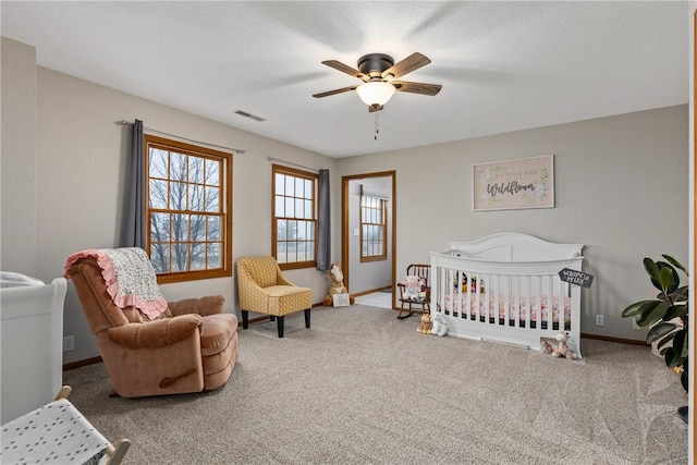 11154 E Ravenwood Ct, Effingham, IL 62401 - bedroom featuring carpet flooring, a ceiling fan, and a crib