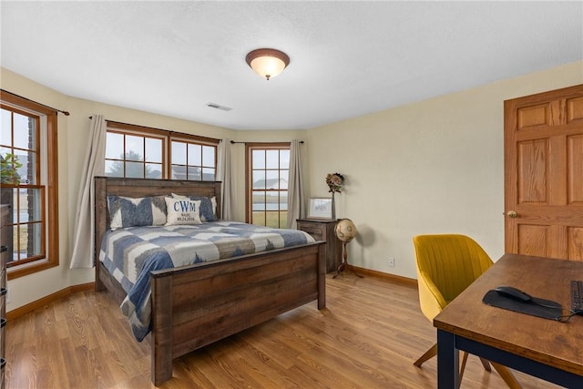 11154 E Ravenwood Ct, Effingham, IL 62401 - bedroom with wood finished floors and an office area
