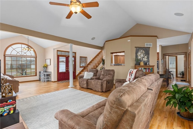 11154 E Ravenwood Ct, Effingham, IL 62401 - living room with vaulted ceiling, wood finished floors, ceiling fan, ornate columns, and stairway