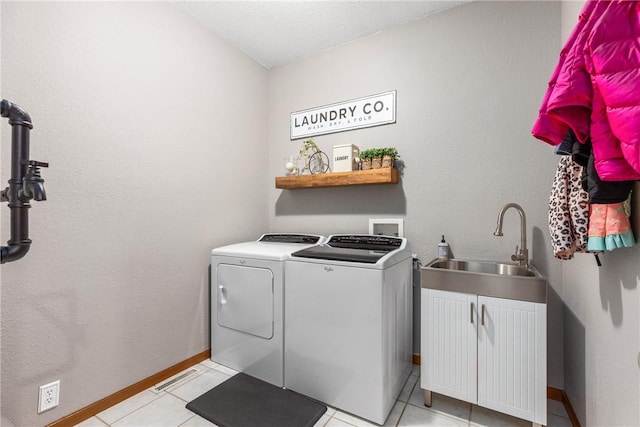 11154 E Ravenwood Ct, Effingham, IL 62401 - laundry room featuring separate washer and dryer and light tile patterned floors