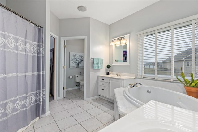 11154 E Ravenwood Ct, Effingham, IL 62401 - bathroom featuring tile patterned flooring, vanity, a bath, and a shower with shower curtain