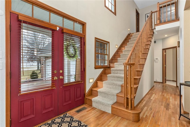 11154 E Ravenwood Ct, Effingham, IL 62401 - entryway with a towering ceiling, wood finished floors, and stairs