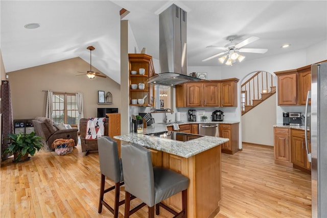 11154 E Ravenwood Ct, Effingham, IL 62401 - kitchen with ceiling fan, island range hood, a peninsula, stainless steel appliances, and open floor plan