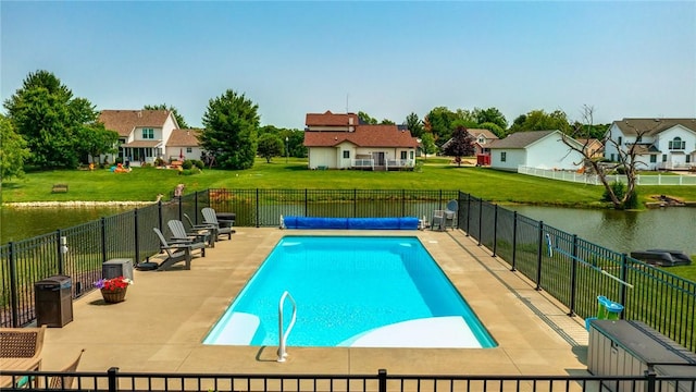 11154 E Ravenwood Ct, Effingham, IL 62401 - view of pool featuring a residential view, a water view, a patio, and a fenced backyard