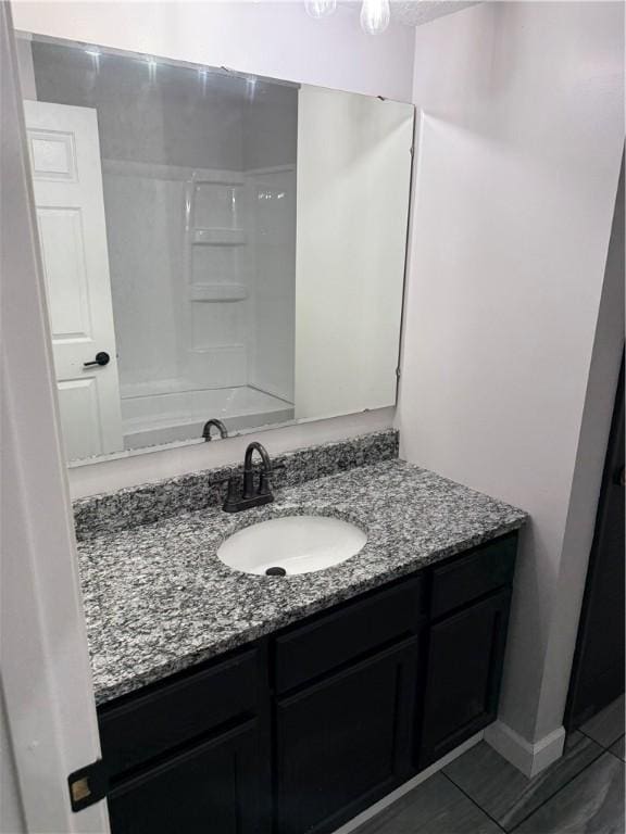full bath featuring shower / bath combination, tile patterned flooring, and vanity