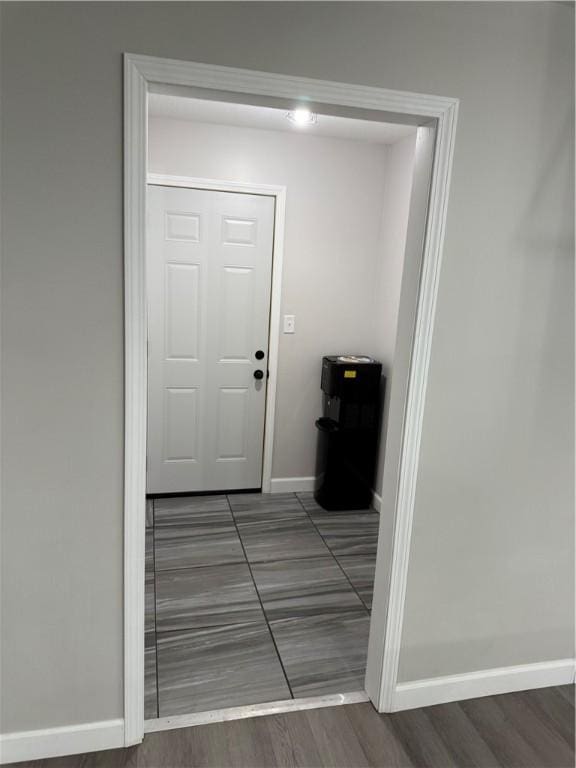 entryway featuring baseboards