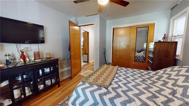 714 Parras St, Danville, IL 61832 - bedroom featuring wood finished floors, a closet, a ceiling fan, and crown molding