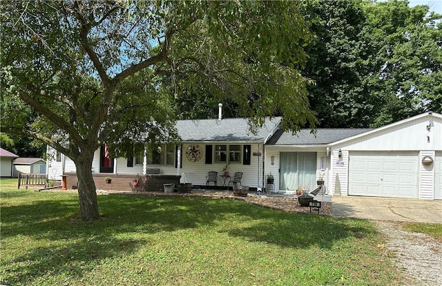 714 Parras St, Danville, IL 61832 - single story home featuring driveway, a front lawn, a garage, a porch, and roof with shingles