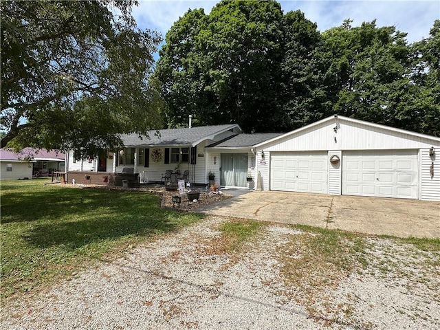 714 Parras St, Danville, IL 61832 - ranch-style home with driveway, a front yard, an attached garage, and a porch