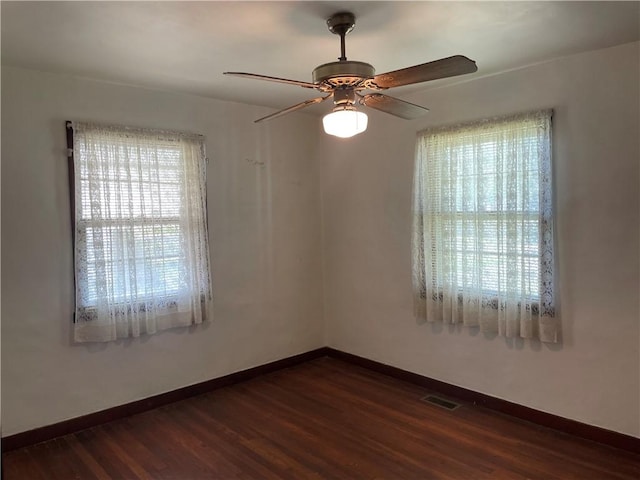 510 W Elm St, Hoopeston, IL 60942 - empty room with a ceiling fan and dark wood-style floors