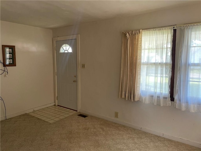 510 W Elm St, Hoopeston, IL 60942 - entryway featuring light colored carpet and baseboards