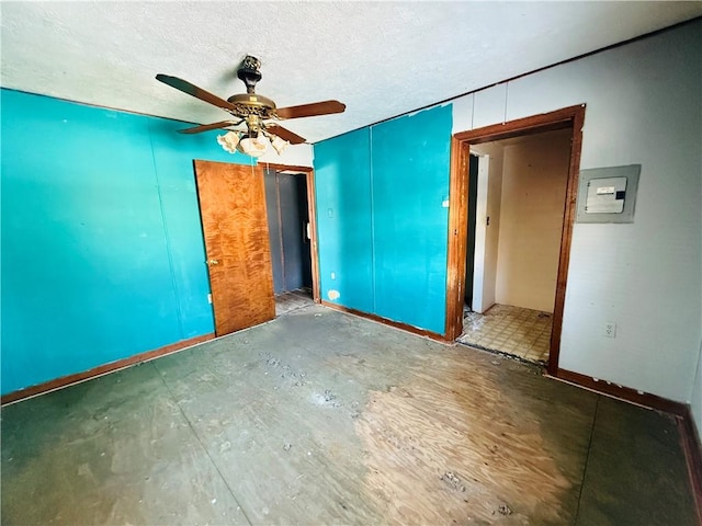 spare room featuring a textured ceiling and ceiling fan