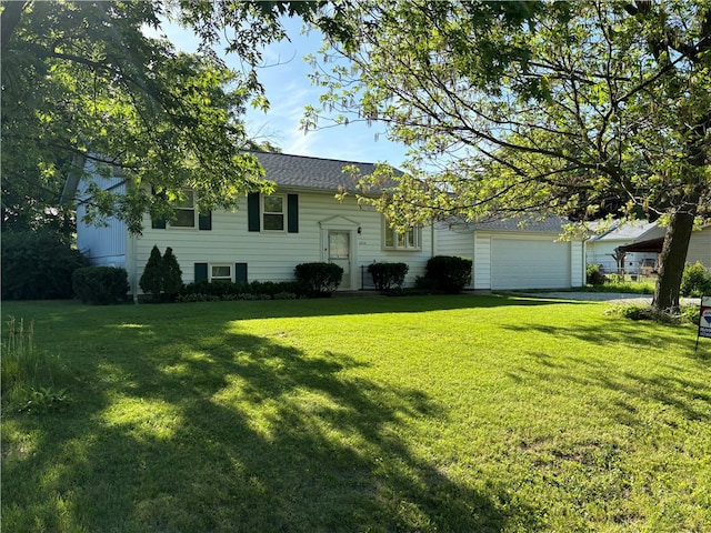 view of front facade with a garage and a front yard