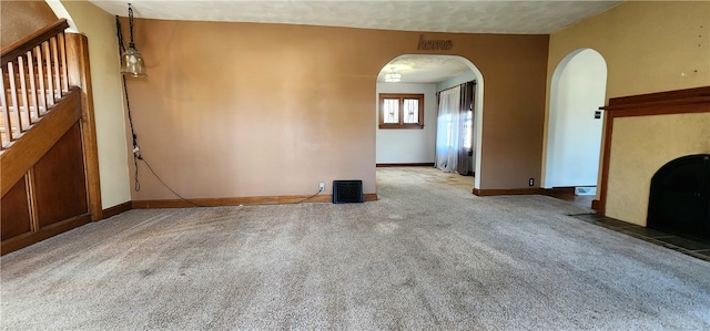 unfurnished living room with carpet floors