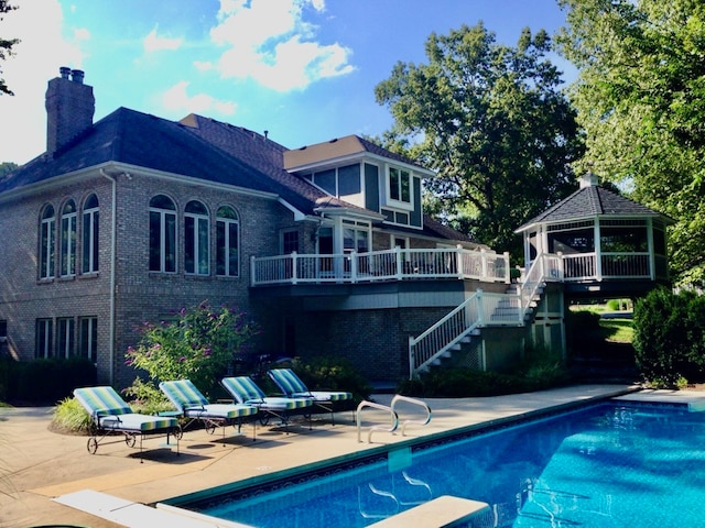 view of pool with a gazebo and a patio area