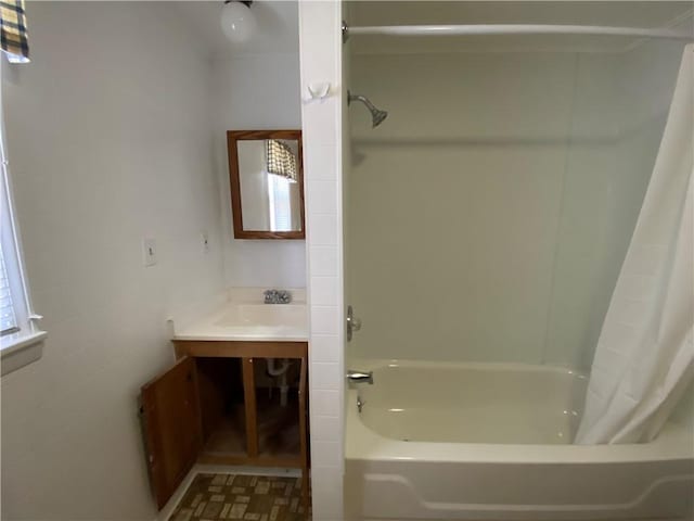 bathroom featuring shower / tub combo with curtain and vanity