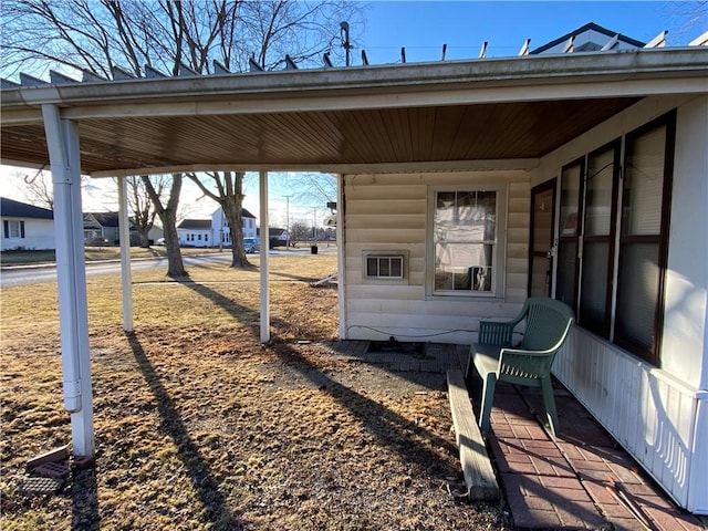 exterior space with a carport