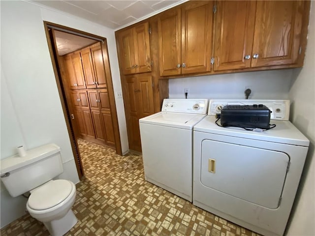 laundry area featuring washer and dryer, laundry area, and light floors