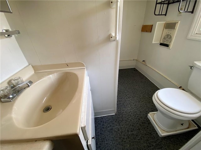 bathroom featuring toilet and a sink