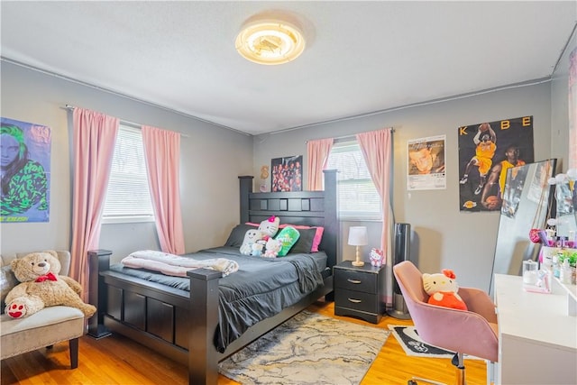 bedroom featuring light wood-style floors