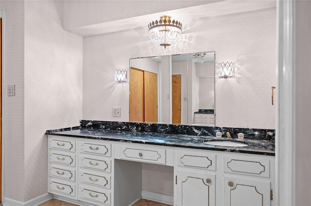 bathroom featuring vanity and baseboards