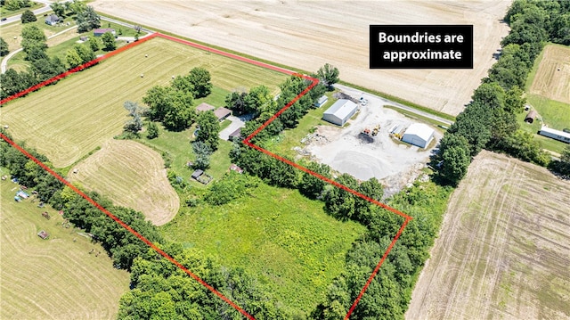 birds eye view of property with a rural view