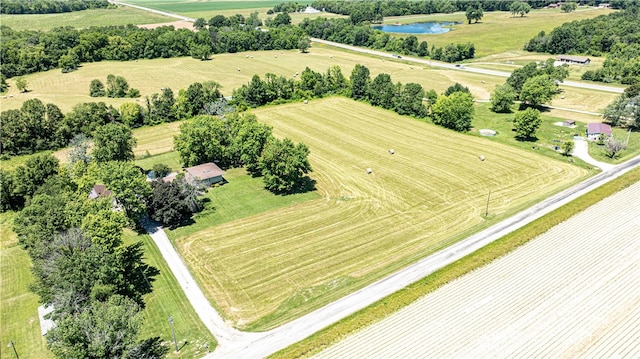 bird's eye view featuring a rural view and a water view