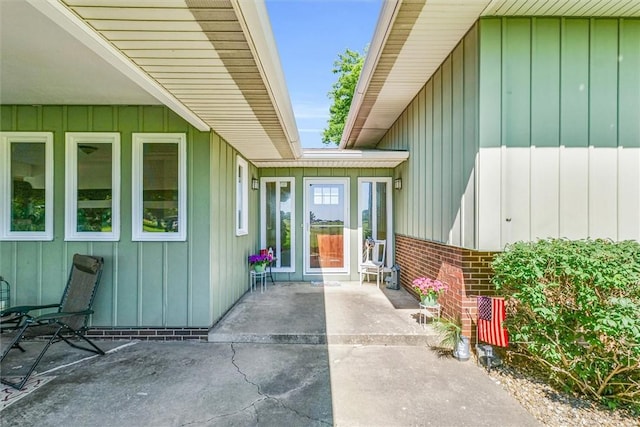 1283 N 1400 E Rd, Shelbyville, IL 62565 - property entrance featuring board and batten siding and a patio area