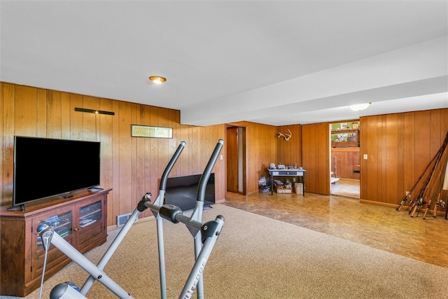 workout area with wood walls